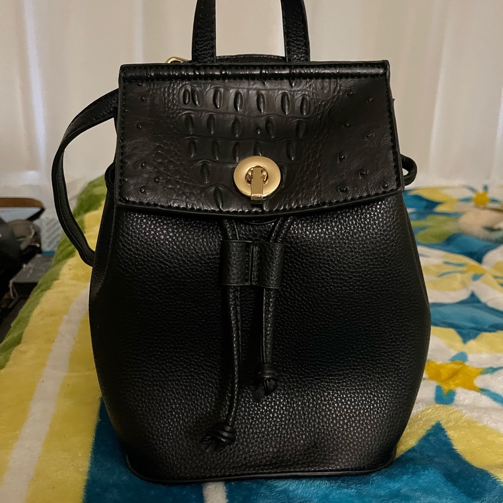 Cute, trendy, black, backpack, small size and in excellent condition.